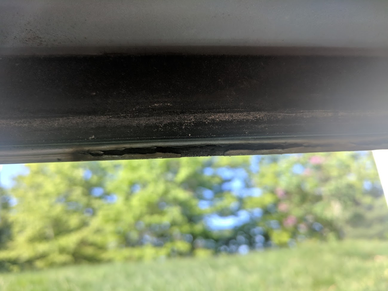 Fuzzy photo is fuzzy because it is kinda hard to take a photo of the bottom of a door while holding it open because it doesn’t hold itself open anymore, on a very sunny day.
